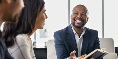 Manager smiling during a successful business negotiation